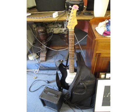 An Urban hero electric guitar with gig bag and an Uncle G-10 amplifier 