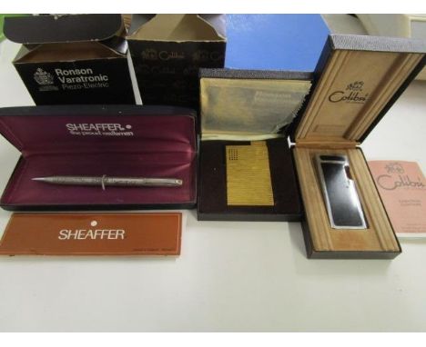 A 925 sterling silver Sheaffer propelling pencil, case with floral decoration, boxed with guarantee leaflet, a boxed Ronson V