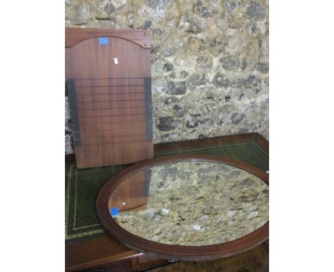 An early 20th century walnut sewing cabinet standing on cabriole legs, 25 1/2"h x 20"w, and a wall mirror 