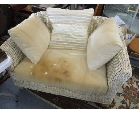 A modern two seater wicker sofa 