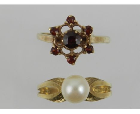 A yellow metal and floral set garnet ring, the shank stamped 375, together with a 9 carat yellow gold and single pearl set ri