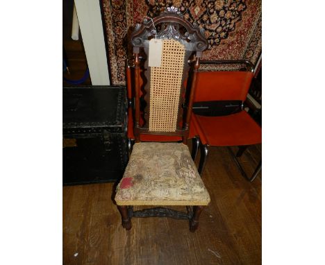 A 16th century style carved walnut and elm side chair, having an acanthus leaf carved cresting rail above a part caned back, 