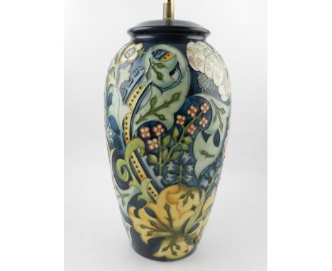 A Moorcroft Pottery table lamp, tube-line decorated with flowers and scrolls.  H.32cm
