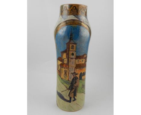 A Daniel Zuloaga, pottery vase, (Spanish, 1852-9121), of cylindrical ovoid form, lustred and painted with a continuous townsc