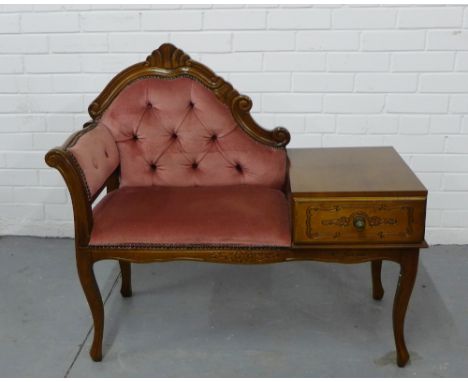 An upholstered button-back telephone table with a carved top rail an cabriole supports with a single drawer to the base, 95cm