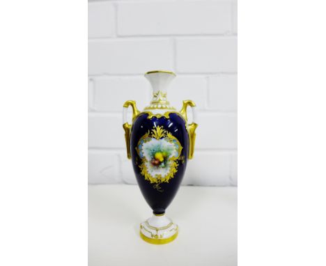 An Edwardian Royal Worcester miniature twin handled vase, cobalt ground with a fruit painted cartouche to front, signed Chive