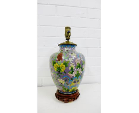 A Cloisonne baluster table lamp, the lilac ground with chrysanthemums and foliage on a pierced hardwood base, height overall 