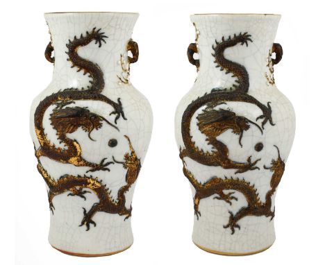 A Pair of Chinese Crackleglaze Porcelain Vases, late 19th century, of baluster form with crabstock handles, decorated in reli