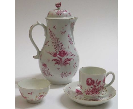 A Worcester coffee pot and cover, circa 1775, decorated in puce and gilt with flowers, 23cm high; a tea bowl and saucer and a