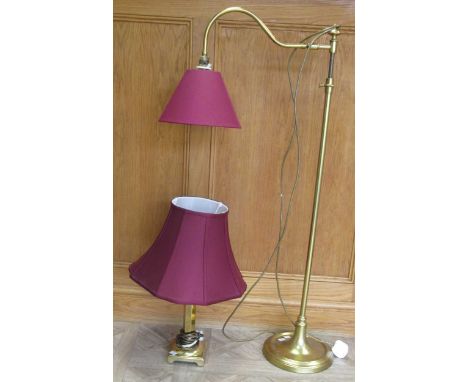 A telescopic brass floor lamp together with a brass table lamp