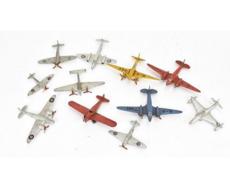 A small collection of Dinky Toys aircraft to include a Light Racer in yellow, two Light Transport in blue and red, Shooting S