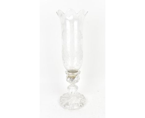 A Baccarat hurricane candlestick, the U-shaped removable shade with acid etched acanthus scrolls, on a moulded wrythen stem a