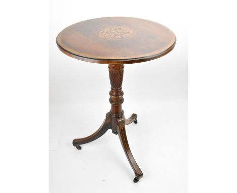 An Edwardian rosewood inlaid tripod table, the circular top with foliate inlaid roundel, resting on a turned reeded baluster 