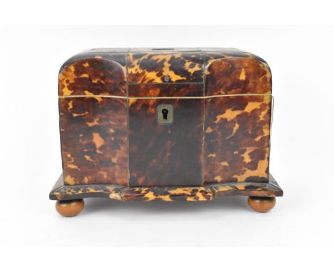 A 19th century tortoiseshell and ivory tea caddy, Regency period, with twin division interior with lids, with ivory trim to t