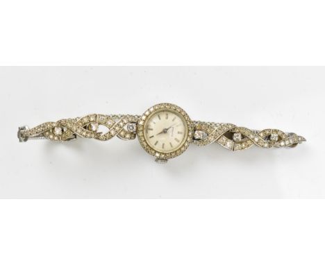 A Zenith, manual wind, ladies, 9ct white gold, vintage cocktail wristwatch, having a silvered dial, baton markers, the bezel 
