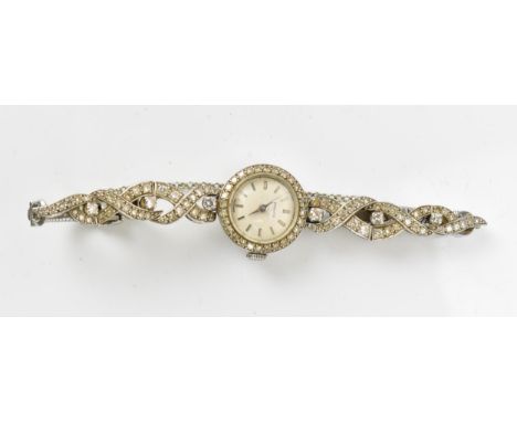 A Zenith, manual wind, ladies, 9ct white gold, vintage cocktail wristwatch, having a silvered dial, baton markers, the bezel 