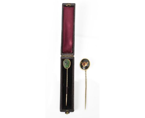 A William Essex style fox head stick pin, together with a Victorian scarab inset stick pin in fitted box 