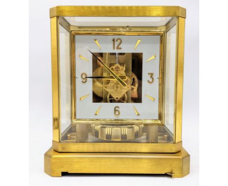 A Jaeger Le Coultre Atmos clock circa 1960s, in a gilt brass case, having a square cream chapter ring with baton and Arabic n