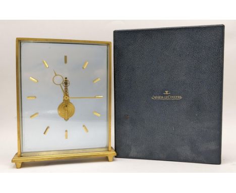 A 1960's Jaeger LeCoultre floating skeleton clock, having a brushed gilt rectangular frame, baton hour markers and inscriptio