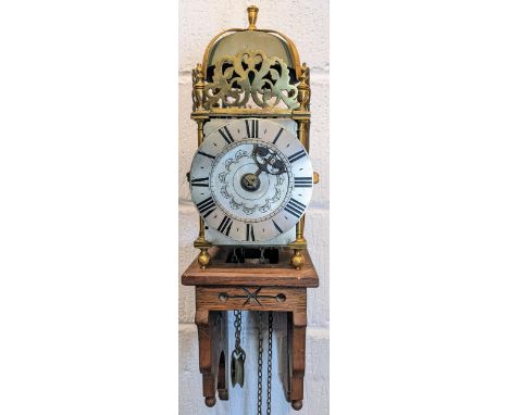 An 18th century and later lantern clock, the four post case with 6" dial applied with Roman numerals and single pierced hand,