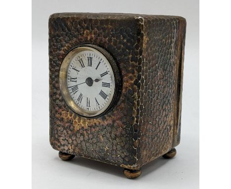 An Edwardian Asprey silver dressing table clock, the case having hammered decoration, initialled 'E.C' to the top, stamped 'A