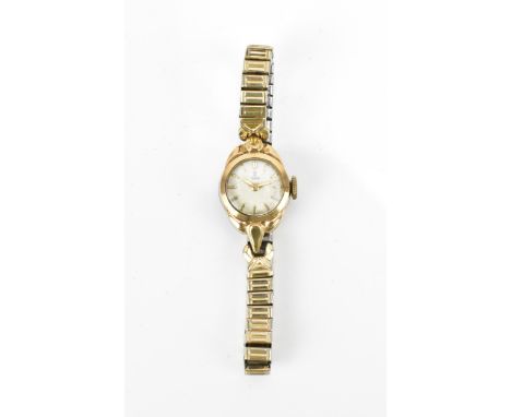 A Tudor, manual wind, ladies, 9ct gold vintage wristwatch, the white dial having Tudor rose logo and gilt baton markers, on a