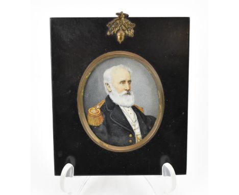 A Victorian portrait miniature on ivory of Captain Welman, circa 1860, within a black painted frame with acorn brass mount, t