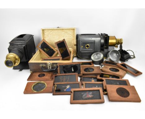 A collection of mechanical and sliding magic lantern slides, of various subjects such as jester dancing, soldier lighting a c