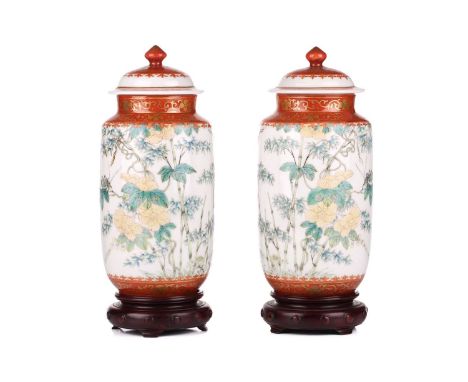 A pair of Chinese Famille Verte porcelain vases and covers, late Qing Dynasty/Early Republic, the domed covers with pommel fi