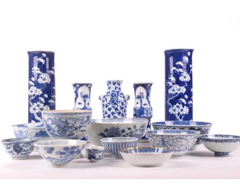 A study collection of Chinese blue and white porcelain including a circular bowl, the interior painted with a rampaging four-