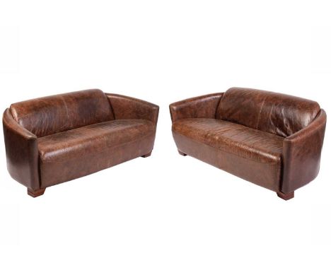 A pair of art deco style distressed brown hide two-seat sofas with swept arms and block feet. 167 cm wide x 32 cm deep x 72 c