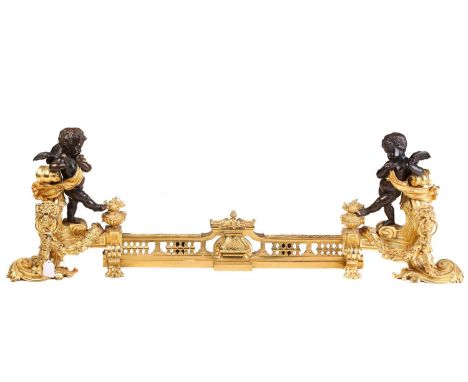 A pair of Napoleon III style figural chenets, with patinated amorini mounted at each end, standing on architectural oak leafe