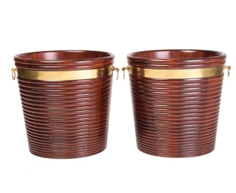 A pair of Regency style brass-bound mahogany peat buckets, of coopered ribbed form, the brass collars with loop handles, late
