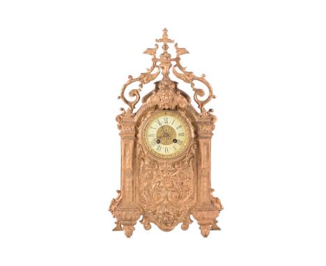 A Nineteenth-century gilt metal mantel clock, the case in the Baroque style with peacock head scrolling surmount, above scrol