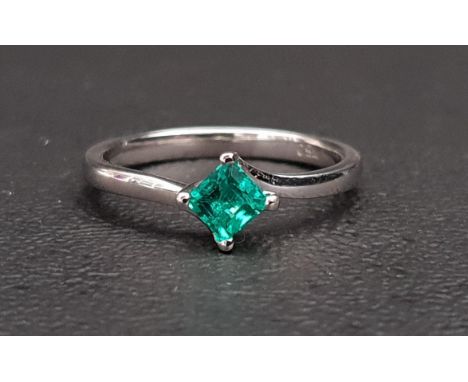 EMERALD SINGLE STONE RINGthe squre cut emerald approximately 0.35cts, on eighteen carat white gold shank, ring size J-K 