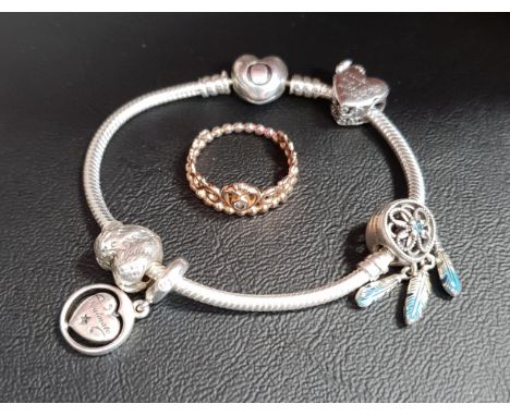 SELECTION OF PANDORA JEWELLERYcomprising a heart clasp Moments silver charm bracelet with four charms; and a Pandora rose Tia