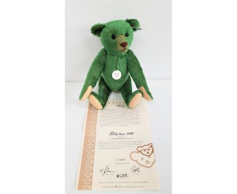 LIMITED EDITION STEIFF TEDDY BEAR 1908 REPLICAin green mohair, number 1629 of 3000, with certificate, with button to ear and 