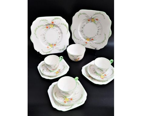 GLADSTONE CHINA PART TEA SETdecorated with a white ground with flowers and green highlights, comprising six cups, twelve sauc