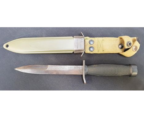 WEST GERMAN M-3 MILITARY KNIFEwith a black steel stilleto 17cm blade and chequered black grip, in a resin scabbard with steel