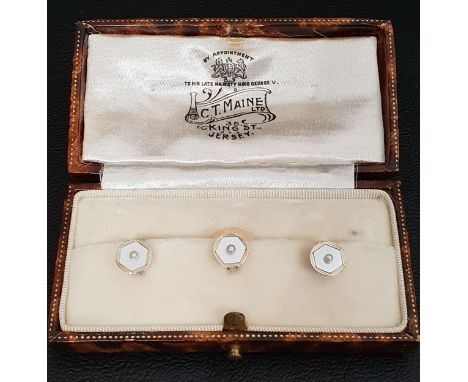 SET OF THREE ENAMEL AND SEED PEARL DRESS STUDSin eighteen carat nine carat gold, in fitted box 