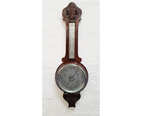 MAHOGANY CASED ANEROID WHEEL BAROMETERwith a thermometer on a silvered scale above a circular silvered dial marked Robert Ste