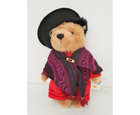 LIMITED EDITION STEIFF AUNT LUCY BEARin mohair and wearing a dress, shawl, hat and glasses, number 69 of 1500, with paper tag