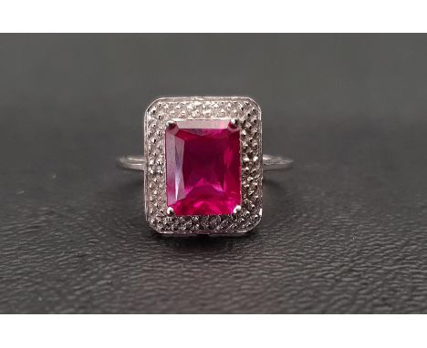 RUBY AND DIAMOND CLUSTER RINGthe created ruby approximately 2.5cts in surround set with small diamonds, on nine carat white g