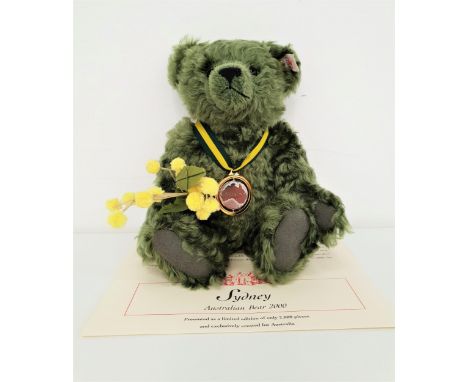 LIMITED EDITION STEIFF SYDNEY AUSTRALIAN BEARin green mohair and carrying a branch of 'Wattle' and wearing a medallion, numbe