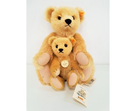 TWO STEIFF CLASSIC SERIES 1909 TEDDY BEARSboth in angora mohair plush, the larger example with growler, with tags, buttons to