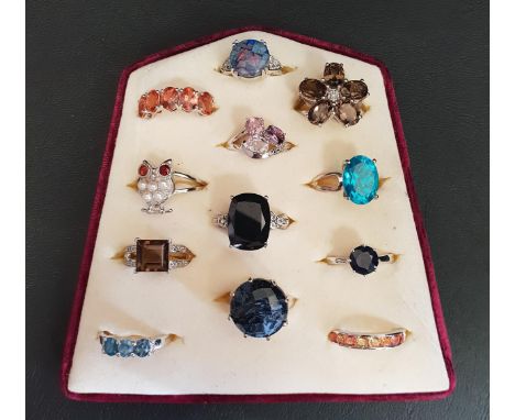 GOOD SELECTION OF TWELVE SILVER RINGSof various designs including topaz and other gemstones, pearl and mosaic opal (12) 