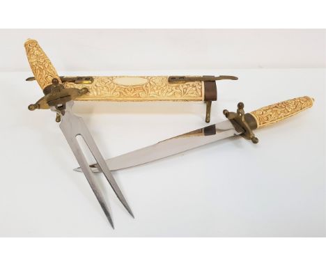 INDIAN RESIN CARVING SETdecorated with flowers to the body and handles of the fork and knife, with brass mounts, 45cm long 