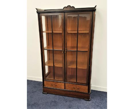 1930s COROMANDEL DISPLAY CABINETwith a three quarter gallery top with a carved fan detail above two panelled glass doors and 