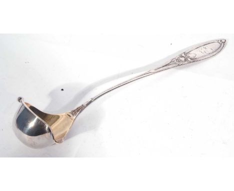 Continental white metal punch ladle in Art Nouveau taste, having Iris embossed pointed handle, the gilt lined bowl with two p