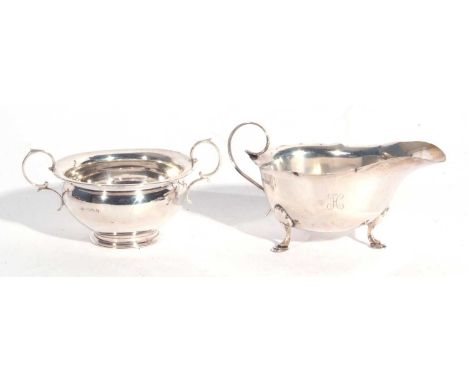 Mixed Lot: George V silver sauce boat with card cut rim, scroll handle, engraved with initial 'H', standing on three hoof fee